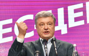 Ukrainian incumbent president Petro Poroshenko delivers a speech at his campaign headquarters in Kiev.