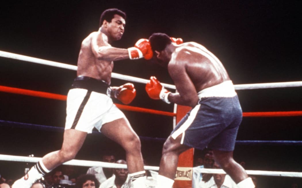 FILE - A file picture dated 30 September 1975 shows US boxer Muhammad Ali (L) hitting the head of his opponent Joe Frazier during their bout in Manila, Philippines. Born Cassius Clay, boxing legend Muhammad Ali, dubbed 'The Greatest,' died on 03 June 2016 in Phoenix, Arizona, USA, at the age of 74, a family spokesman said. Photo: dpa (Photo by UPI / DPA / dpa Picture-Alliance via AFP)