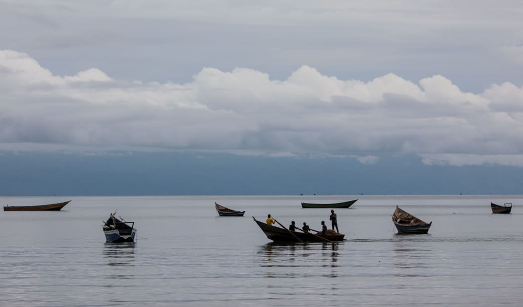 SEBAGORO, UGANDA - APRIL 04: Children row a boat on Lake Albert by the UNHCR landing site for refugee arrivals from the Democratic Republic of Congo on April 4, 2018 in Sebagoro, Uganda.