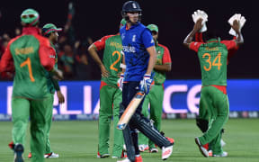 Bangladeshi players celebrate the dismissal of England batsman Stuart Broad during the match at the Adelaide Oval.