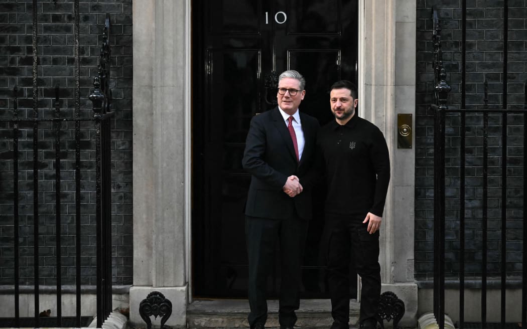 Ukraine's President Volodymyr Zelensky (R) shakes hands with Britain's Prime Minister Keir Starmer upon arrival to attend a bilateral meeting in central London on 1 March, 2025 ahead of a European leader's summit the following day. The UK Prime Minister on February 28 vowed "unwavering support" for Ukraine following the breakdown in talks between Zelensky and US President Donald Trump, which saw in front of US and international media, Trump and Vice President JD Vance shouting at Zelensky, accusing him of not being "thankful" and refusing to accept their proposed truce terms. (Photo by Ben STANSALL / AFP)