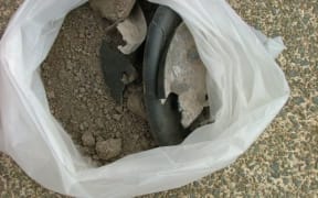 The dirt Don Cottle found in the base of his standard lamp, and part of the plastic bag that failed to contain it.