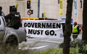 Anti-government protester in Wellington, marching towards Parliament on 23 August 2022.
