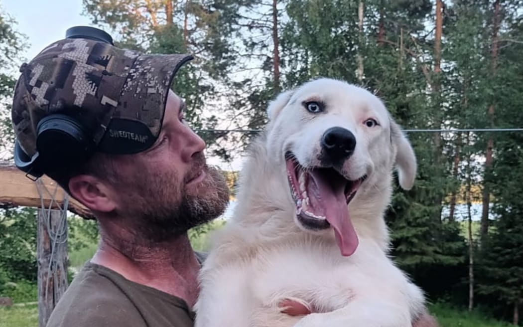 Brendon Johnston with husky dog