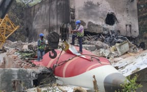 Members of Indian Army's engineering arm prepare to remove the wreckage of an Air India aircraft, bound for London's Gatwick Airport, which crashed during take-off from an airport in Ahmedabad, India June 14, 2025. (Photo by Basit Zargar / Middle East Images via AFP)