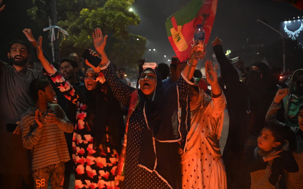 Supporters of Pakistan's former prime minister Imran Khan take part in a protest against the assassination attempt on Khan, outside the hospital where Khan is admitted, in Lahore on 3 November 2022.