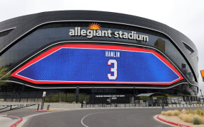 A video board at Allegiant Stadium, home of the Las Vegas Raiders, displays a show of support for Buffalo Bills player Damar Hamlin.
