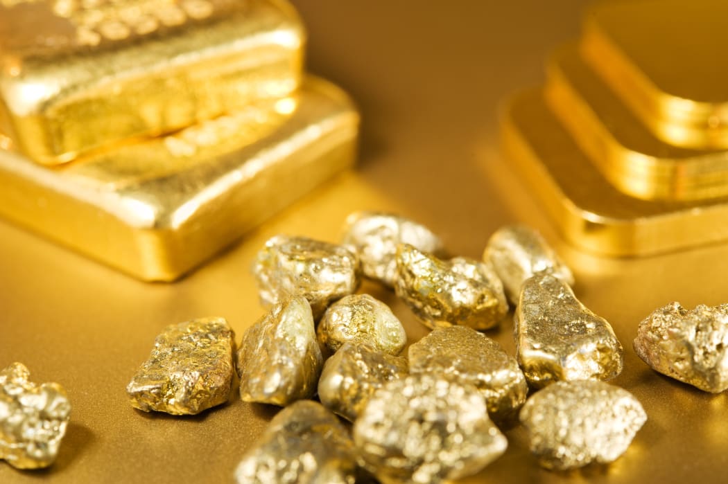 A collection of gold bars, ingots and nuggets (file)