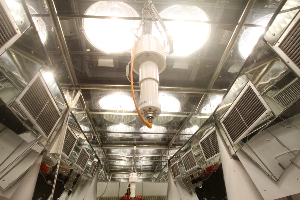 The Controlled Environment Laboratory - the ceiling of one of the rooms with the lights on, showing the top ventilation, glass ceiling and automated misting system.