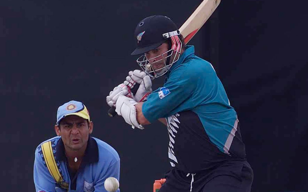 Chris Cairns bats during the ICC Knockout Trophy Final.