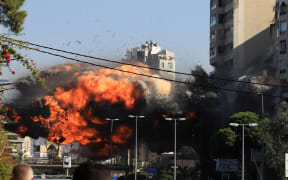 A ball of fire erupts as an Israeli strike hits a building in Beirut's southern Ghobeiri neighbourhood on 15 November 2024, amid the ongoing war between Israel and Hezbollah. (Photo by AFP)