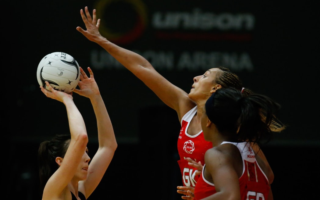 England's Geva Mentor and Silver Fern Bailey Mes clash in Rotorua in 2014.
