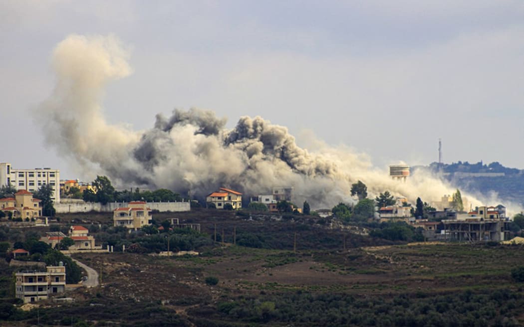 Smoke billows from a site targeted by Israeli shelling in the southern Lebanese border village of Tayr Harfa on July 24, 2024, amid ongoing cross-border clashes between Israeli troops and Hezbollah fighters.  (Photo by Kawnat HAJU / AFP)