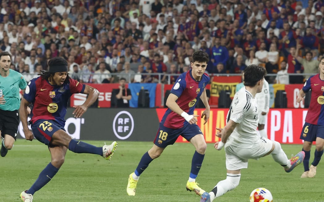 Barcelona defender Jules Kounde scores the goal that gave his side victory over Real Madrid in their Spanish Cup, Copa del Rey final in Seville, 27 April, 2025.
