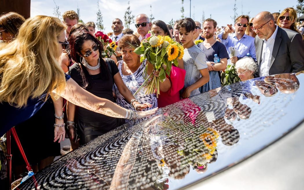 Relatives attend the unveiling of the National Monument for the MH17 victims in Vijfhuizen, the Netherlands  on July 17, 2017.