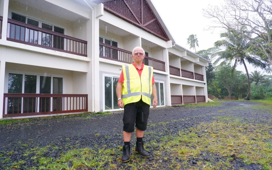 Developer Christopher Vaile stands in front of the first section of the property that is being renovated.