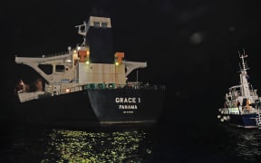 A handout picture released by the Ministry of Defence shows the Panama registered Grace 1 tanker halted by Gibraltar police and a detachment of UK soldiers