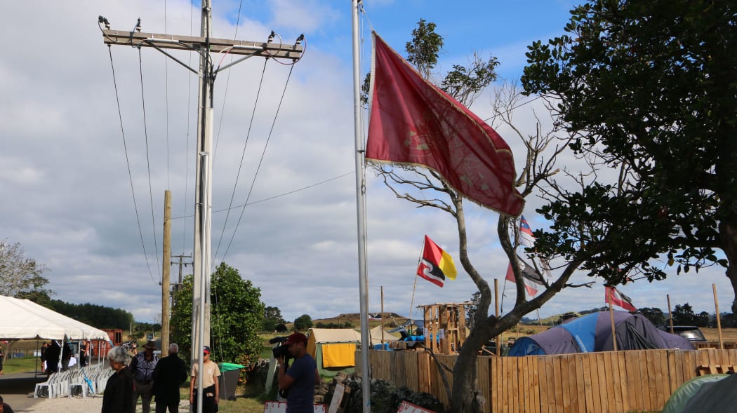 The Kiingitanga flag flying at Ihumātao.