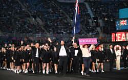 New Zealand’s flag bearers Tom Walsh and Joelle King lead their country’s athletes in the Parade of Nations during the opening ceremony for the Commonwealth Games at the Alexander Stadium in Birmingham, central England, on 28 July 2022.