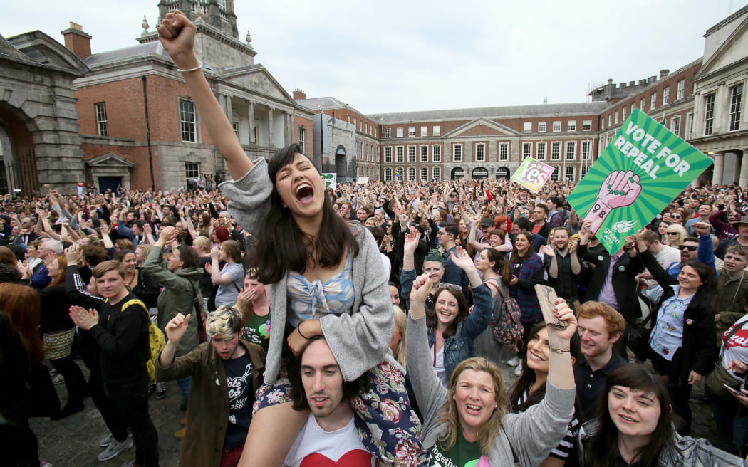 'Yes' campaigners celebrate the official result of the Irish abortion referendum at Dublin Castle in Dublin on May 26, 2018.