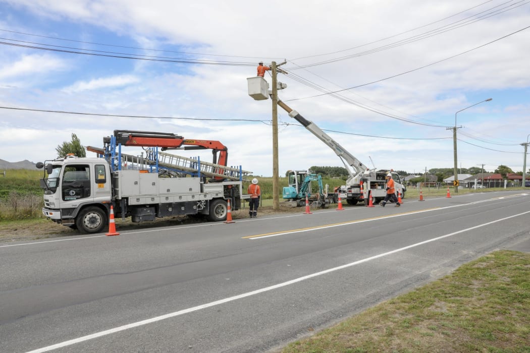 Crews work on repairs after crash at the corner of Cuthberts Road and Breezes Road in Christchurch where two people died.