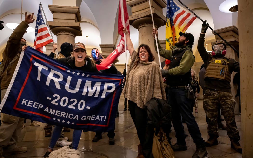WASHINGTON, DC - JANUARY 6: Supporters of US President Donald Trump protest inside the US Capitol on January 6, 2021, in Washington, DC. - Demonstrators breeched security and entered the Capitol as Congress debated the 2020 presidential election Electoral Vote Certification.   Brent Stirton/Getty Images/AFP (Photo by BRENT STIRTON / GETTY IMAGES NORTH AMERICA / Getty Images via AFP)