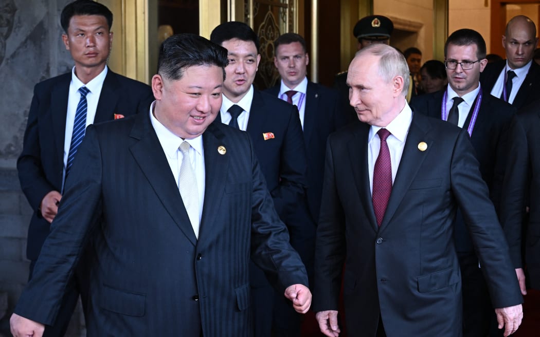 Russian President Vladimir Putin sees North Korean leader Kim Jong Un off following their talks after attending a military parade marking the 80th anniversary of victory over Japan and the end of World War II, in Beijing on 3 September, 2025.