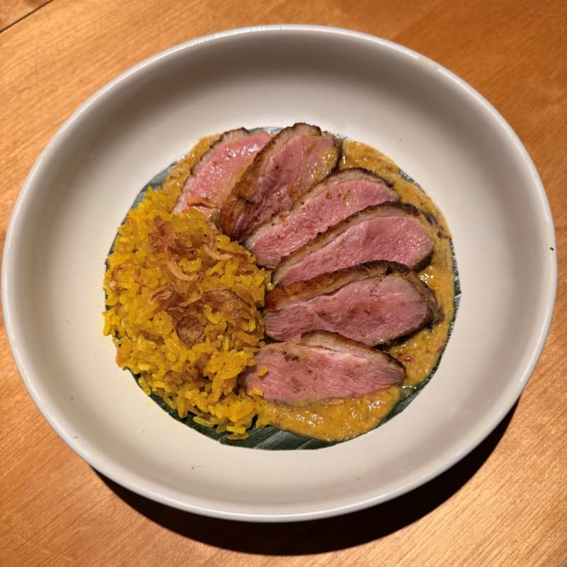 A dish of slices of panfried duck breast.