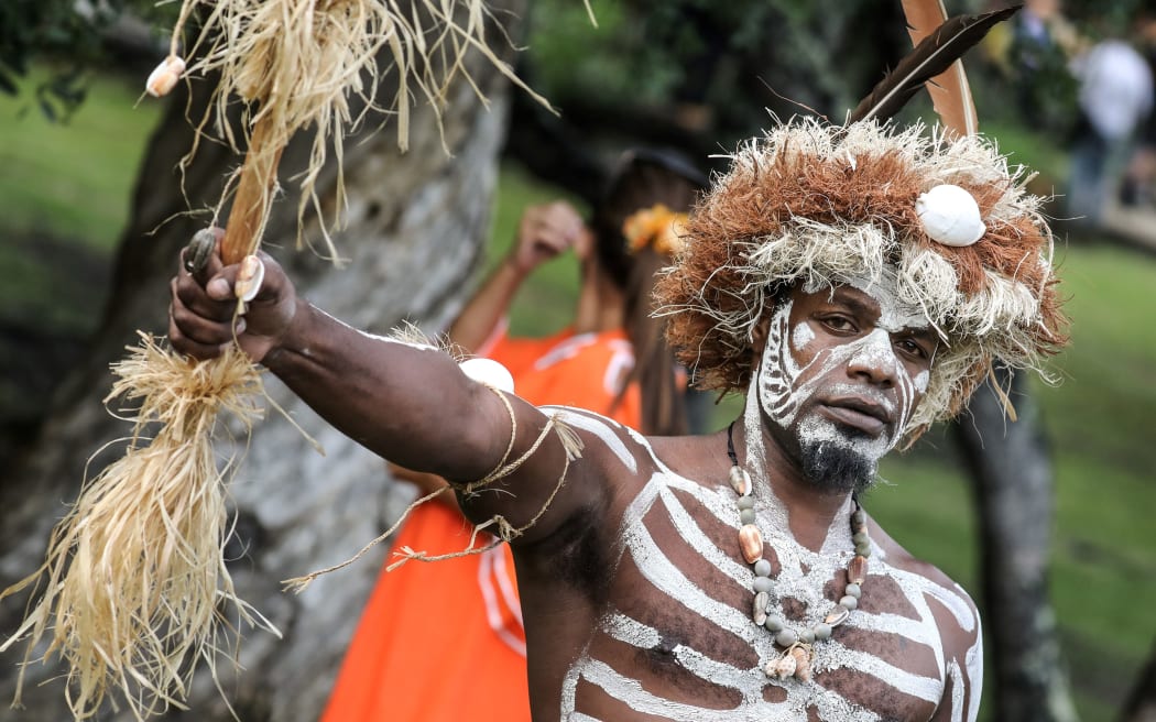 Traditional dancers attend the traditional costume ceremony at the Jean-Marie Tjibaou cultural center with the French president in Noumea, New Caledonia, on May 5, 2018.  / AFP PHOTO / Ludovic MARIN