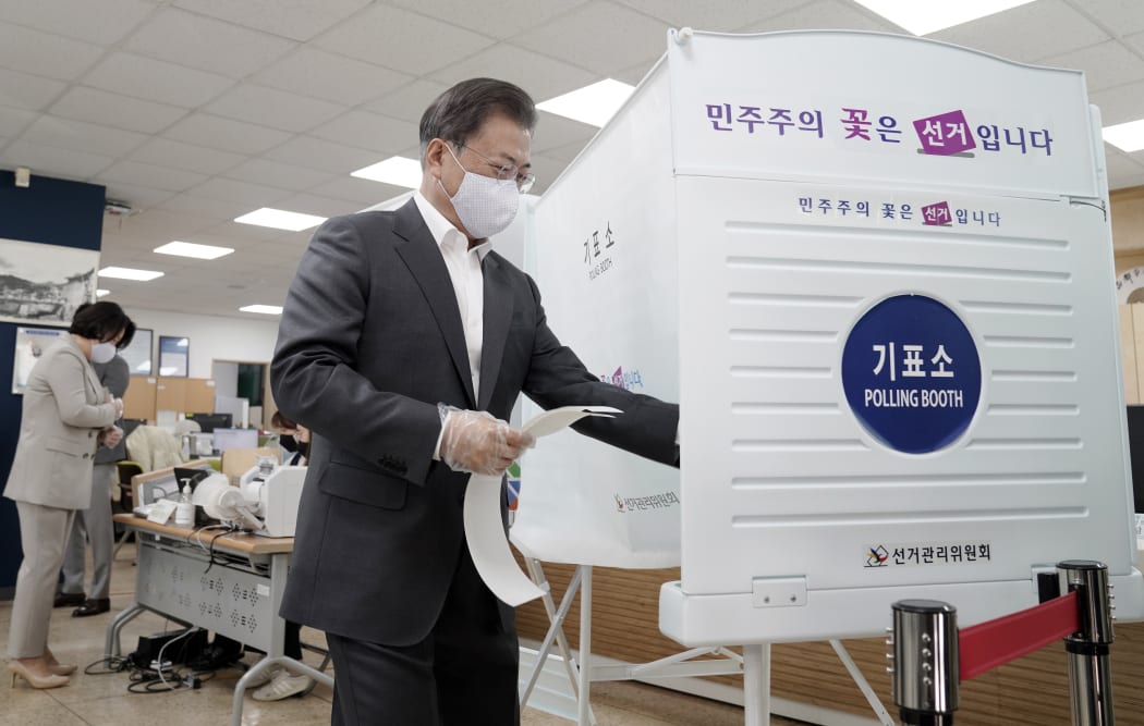 South Korean President Moon Jae-in casting his early ballot for the upcoming parliamentary elections at a polling station in Seoul on 10 April, 2020.