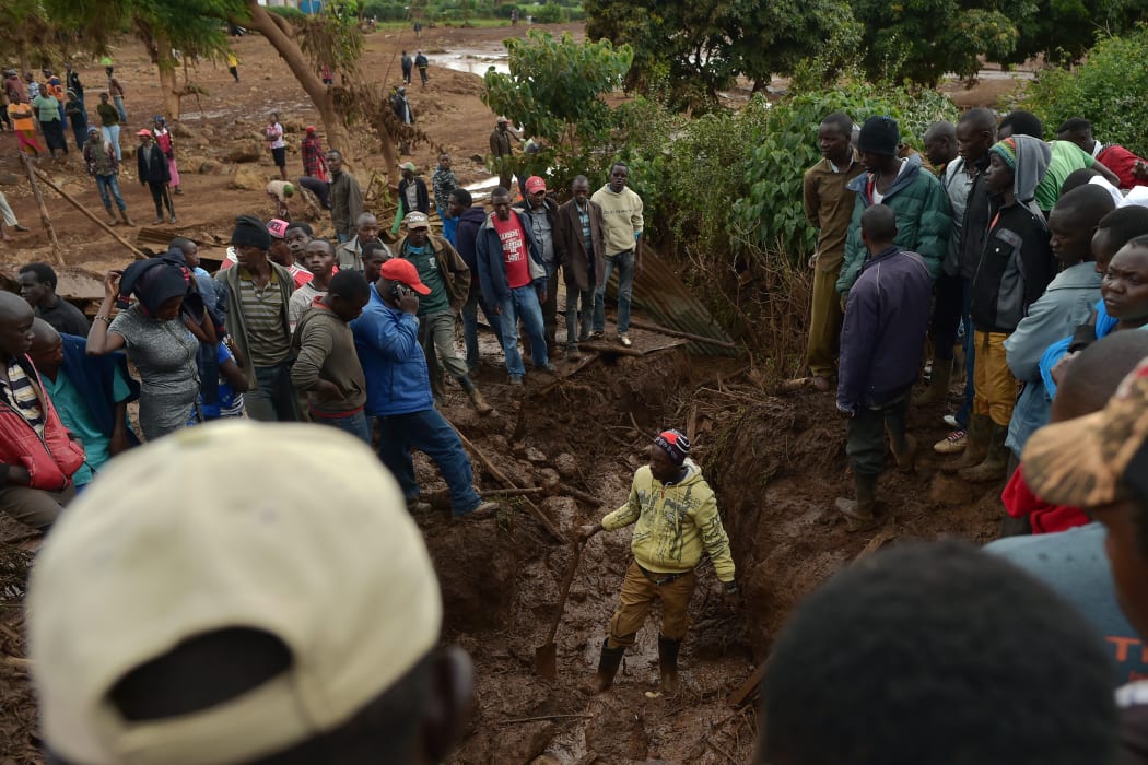 Villagers dig through mud as they attempt to find survivors of flash flooding at Solai.