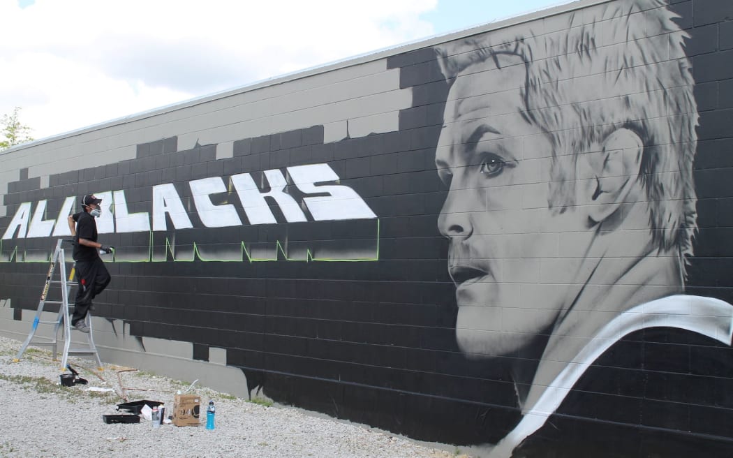 Street artist Tane Lawless has painted a giant mural of a serious looking Richie McCaw in Taupo.