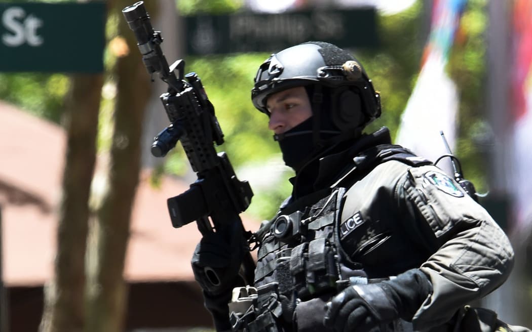 An armed policeman seen outside the Lindt Chocolat Cafe in Syndey's Martin Place.