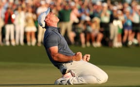 AUGUSTA, GEORGIA - APRIL 13: Rory McIlroy of Northern Ireland celebrates winning the 2025 Masters Tournament after the first playoff hole on the 18th green at Augusta National Golf Club on April 13, 2025 in Augusta, Georgia.   Richard Heathcote/Getty Images/AFP (Photo by Richard HEATHCOTE / GETTY IMAGES NORTH AMERICA / Getty Images via AFP)