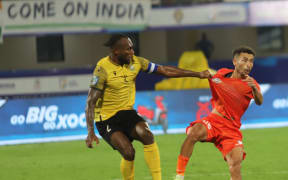 Brian Kaltak tussles with an opposing player in Bhubaneswar
