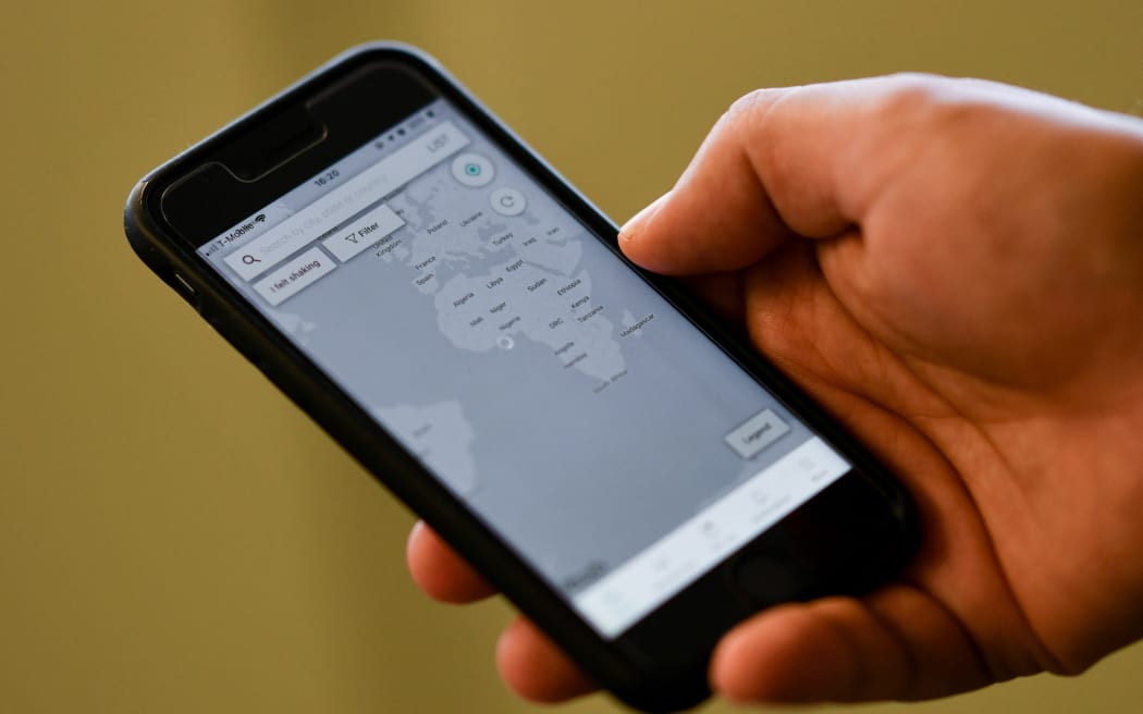A person checks the "MyShake" app on their smartphone in Hollywood on 17 October, 2019. California launched the country's first earthquake warning system in the hope that residents will be alerted within seconds of a possible impending disaster and can  "drop, cover and hold on."