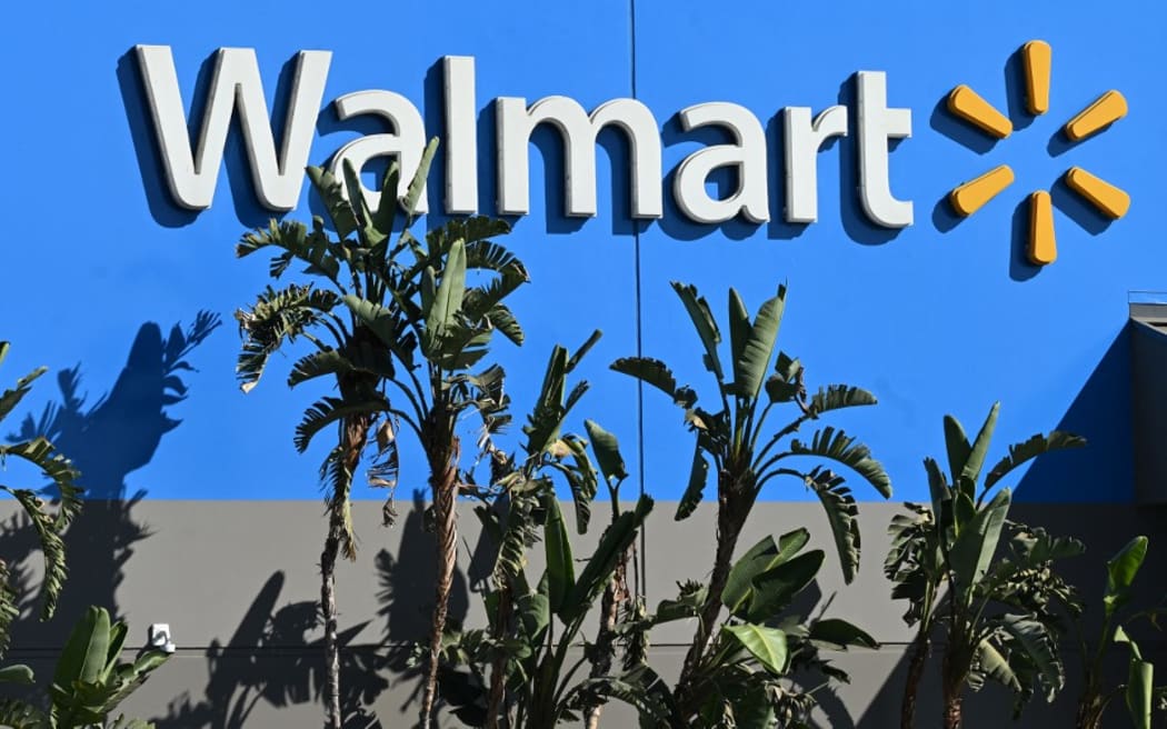 (FILES) In this file photo taken on August 15, 2022, a Walmart store in Burbank, California. - Walmart saw its earnings top expectations in the third quarter on November 15, 2022, as consumers looked for bargains amid surging inflation, but its numbers were bogged down after a settlement announced November 2, relating to opioid cases. The big-box retailer said it "continued to gain market share" in the grocery segment, raising its full-year outlook on strong results despite a challenging environment this year. (Photo by Robyn Beck / AFP)