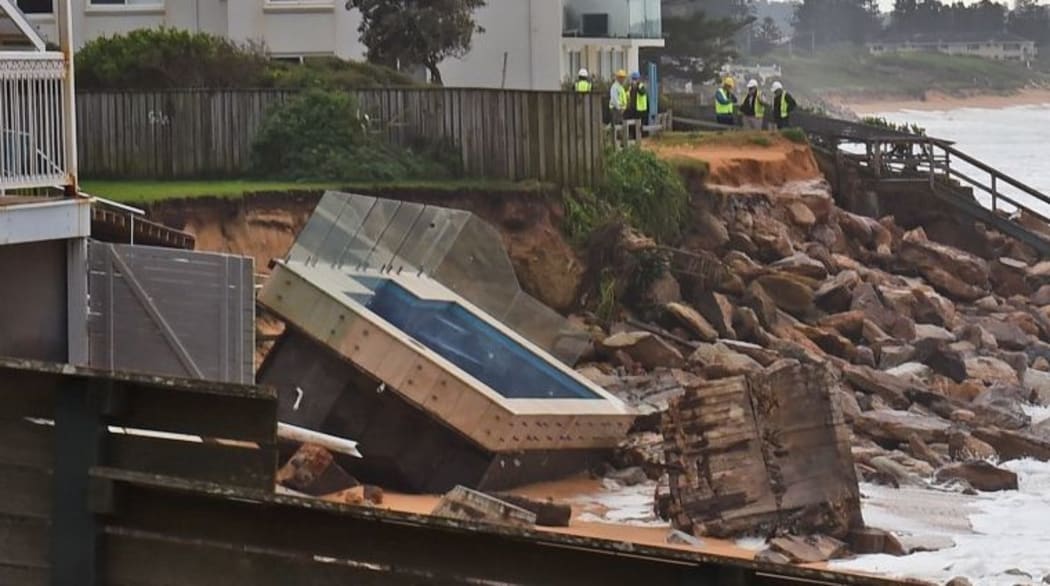 An inground pool sits amongst the rocks after a severe storm at Collaroy on Sydney's northern beaches.