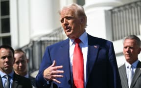 US President Donald Trump speaks during a photo opportunity with autoracing officials and champions on the South Portico of the White House on April 9, 2025, in Washington,