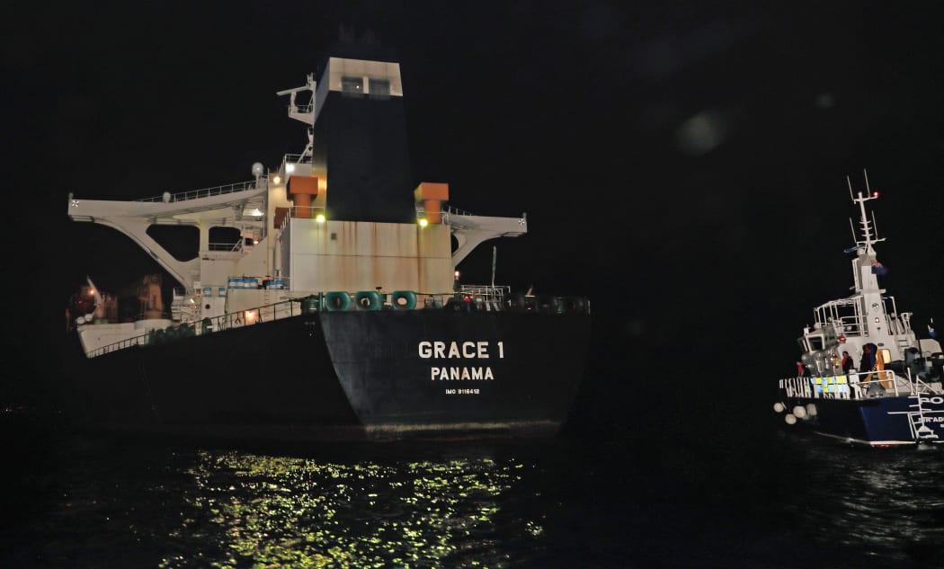 A handout picture released by the Ministry of Defence shows the Panama registered Grace 1 tanker halted by Gibraltar police and a detachment of UK soldiers