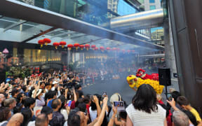 Hundreds of people gathered at the Auckland Sky Tower on 22 January, 2023, to watch the lion dance, cultural performances, and calligraphy demonstrations in celebration of the Lunar New Year.