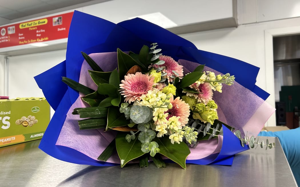 A Wellington woman is recovering at home after she was forcefully flung to the ground while trying to stop someone stealing fuel from a petrol station.