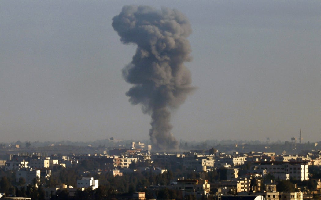 This picture taken from the Israeli-annexed Golan Heights shows smoke billowing above the Syrian Governorate of Quneitra during Israeli bombardment, on December 9, 2024. - Israel launched strikes on weapons depots in Syria's east on December 8, a war monitor said, after rebels toppled Bashar al-Assad's government earlier. (Photo by Jalaa MAREY / AFP)