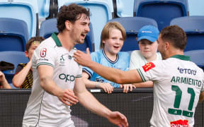 Isaac Hughes of the Phoenix (15) celebrates scoring a goal with team-mates during the A-League Men Round 13 match between Sydney FC and Wellington Phoenix at Allianz Stadium in Sydney, Sunday, January 18, 2026. (AAP Image/Mark Evans/ Photosport )
