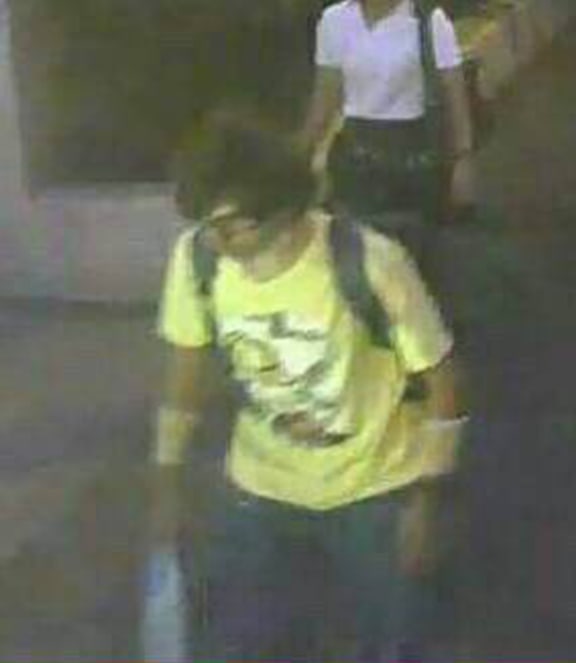 The suspect in the Bangkok bombing, carrying a backpack.