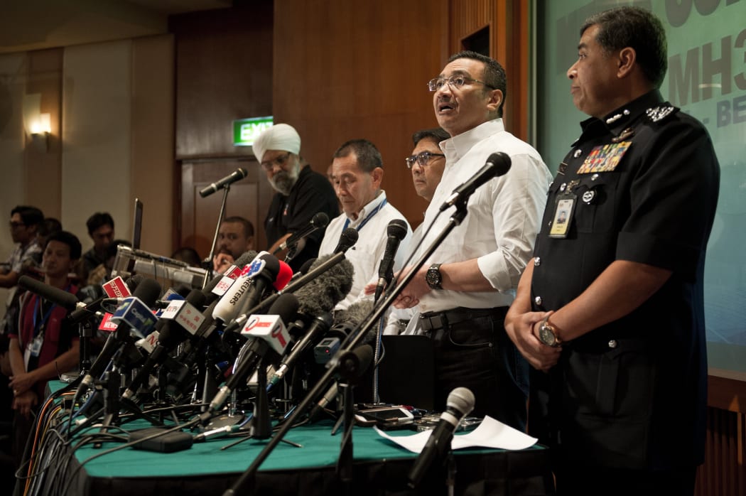 Malaysia's acting Transport Minister Hishammuddin Hussein (second from right) at Sunday's news conference.