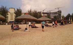 Tourists on a CNMI beach