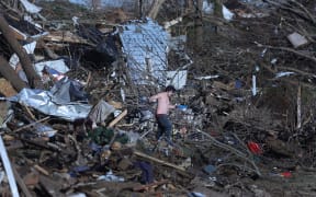 Residents continue to salvage belongings from destroyed homes after a tornado tore through a large section of the city late Friday evening on December 12, 2021 in Mayfield, Kentucky.