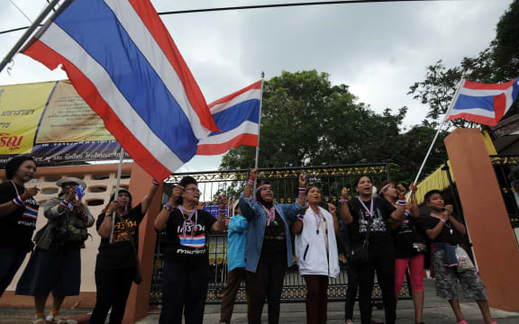 Anti-government protesters gather outside a polling station in a bid to prevent people from voting in Narathiwat, southern Thailand.