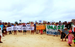 A group marching against the Cook Islands fish deal with the EU